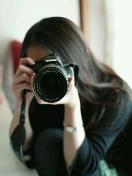 Девушка с фотоаппаратом
